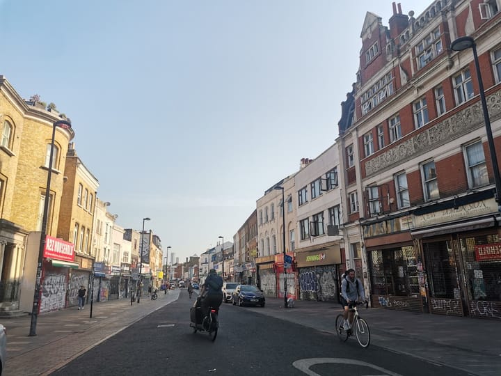 Cyclists and pedestrians using Deptford High Street on morning of 13 May 
